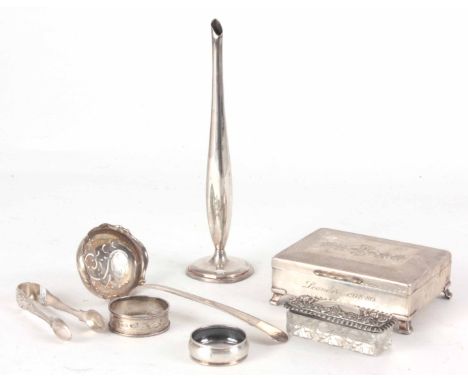 A SELECTION OF SEVEN SILVER AND PLATED ITEMS, a continental silver strainer ladle, two silver napkin rings, a silver topped c