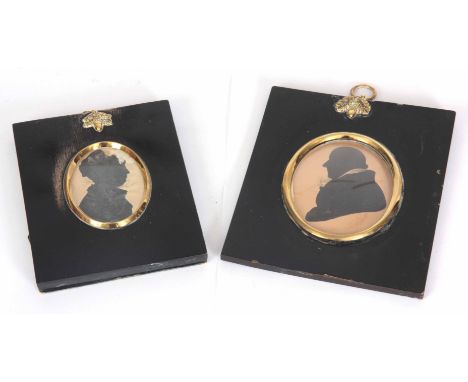TWO OVAL PORTRAIT MINIATURES SILHOUETTES ONE OF A GENTLEMAN, 9cm in gilt and ebonised frame 17cm high 14cm wide the other of 