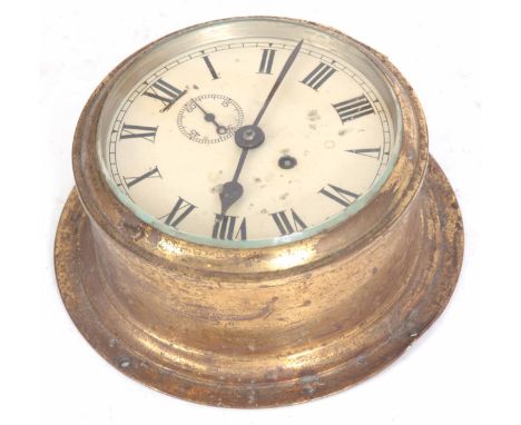 AN EARLY 20th CENTURY BRASS CASED SHIPS CLOCK with drum shaped case enclosing a 5.5" painted dial with subsidiary seconds dia