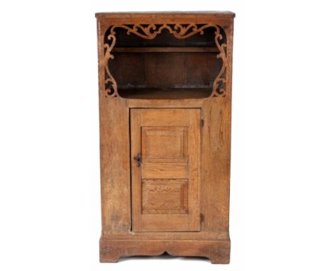 AN EARLY 17TH CENTURY JOINED OAK CUPBOARD with&nbsp;open pierced edge shelf above a fielded&nbsp;cupboard and shaped plinth 8