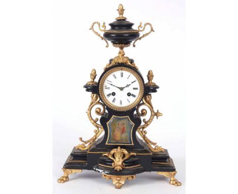 A LATE 19th CENTURY FRENCH GILT MANTLE CLOCK with urn finial and porcelain panel to the front depicting a romantic garden set