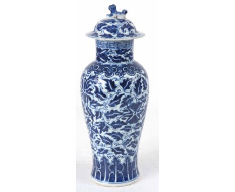 A 19th CENTURY CHINESE PORCELAIN LIDDED BALUSTER VASE WITH DOG OF FOO FINIAL having a four character mark 28cm high.