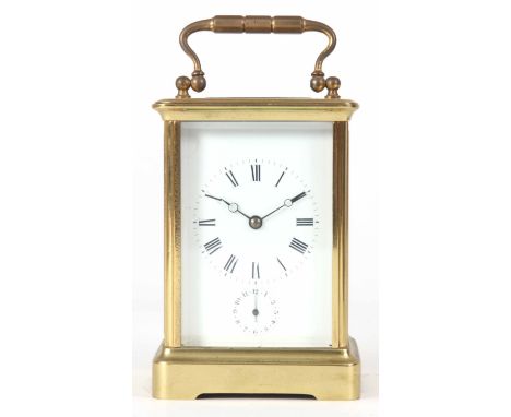 A LATE 19TH CENTURY BRASS FRENCH EIGHT-DAY TIMEPIECE CARRIAGE CLOCK with alarm dial; having original balance wheel escapement