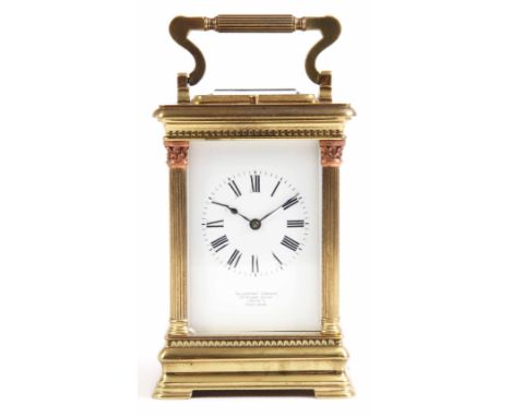 A LATE 19th CENTURY FRENCH REPEATING CARRIAGE CLOCK retailed by Goldsmiths Company, London, the brass case having reeded hing