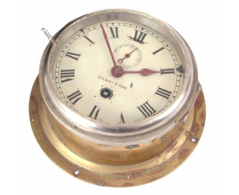 AN EARLY 20th CENTURY ENGLISH BRASS CASED SHIPS CLOCK with 5.5" painted dial signed Grant &amp; Son, fronting an eight-day sp