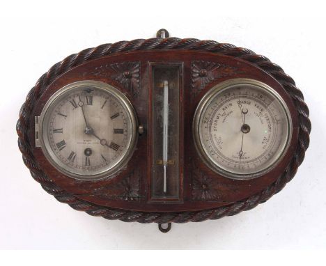 A LATE 19th CENTURY OAK CASED WEATHER STATION with rope edge carved surround enclosing a silvered dial clock with matching ba