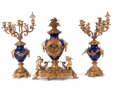 AN EARLY 20th CENTURY FRENCH ORMOLU AND BLUE ENAMEL CLOCK GARNITURE the case surmounted by songbirds above a blue enamel balu
