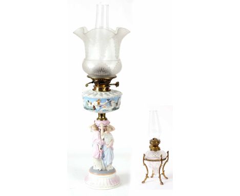 TWO LATE 19TH CENTURY OIL LAMPS including A PORCELAIN OIL LAMP of Neo-Classical design with figural stem and an etched clear 