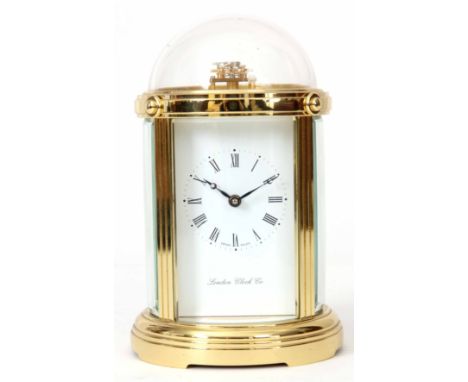 LONDON CLOCK COMPANY, A LATE 20th CENTURY SWISS MADE CARRIAGE CLOCK the brass circular case with curved bevelled glass panels