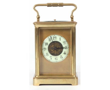 A LATE 19TH CENTURY FRENCH BRASS EIGHT-DAY REPEATING CARRIAGE CLOCK with masked dial and filigree centre, fronting an eight-d