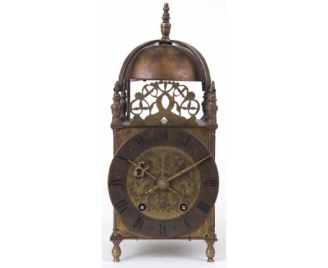 AN EARLY 20th CENTURY BRASS CASED LANTERN STYLE MANTLE CLOCK of typical form with engraved 5.5" dial fronting an eight-day sp