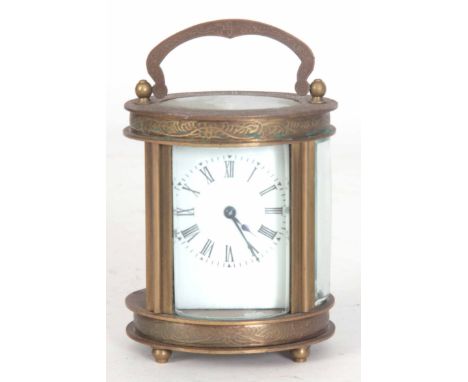 A LATE 20th CENTURY OVAL CASED CARRIAGE CLOCK having chased scrollwork decoration enclosing a 40mm porcelain dial fronting a 