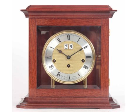 A MODERN QUARTER CHIMING MANTLE CLOCK the mahogany case with bevelled glass panels enclosing a 5" gilt dial with silvered cha