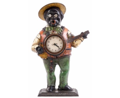 A LATE 19TH CENTURY AMERICAN PAINTED CAST IRON MANTLE CLOCK formed as a black banjo player with removable hat and applied eye