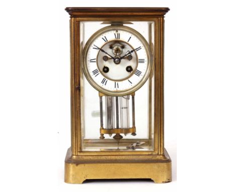 A LATE 19th CENTURY FRENCH FOUR GLASS MANTEL CLOCK the brass case framing four bevelled glass panels with hinged front and ba