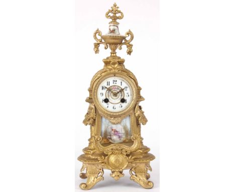 A LATE 19th CENTURY FRENCH MANTLE CLOCK with gilt mounts, surmounted with urn finial and painted romantic scenes to the front