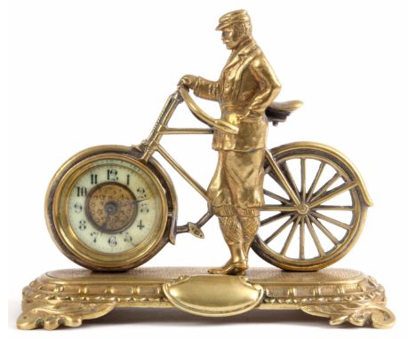 A LATE 19th CENTURY ENGLISH NOVELTY DESK CLOCK formed as a gilt well dressed gentleman stood next to a silver plated bicycle 