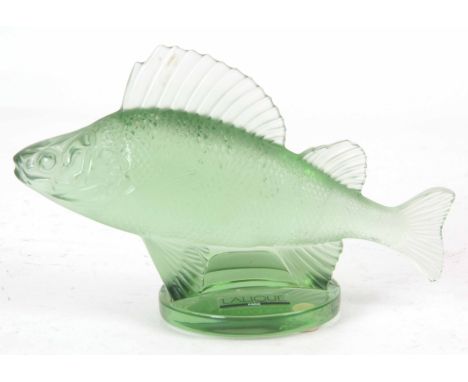 R. LALIQUE, A GREEN GLASS "PERCH" PAPERWEIGHT signed with engraved mark ‘Lalique France’ 10cm high 16cm wide.