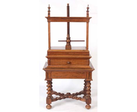 A 18TH CENTURY DUTCH FIGURED WALNUT LINEN PRESS with adjustable super structure having five leaves for pressing linen on a la