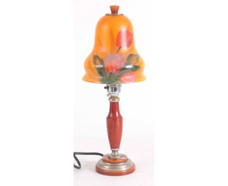 AN ART DECO PHENOLIC TABLE LAMP with shaped enamel painted shade 36cm high.