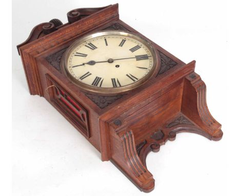 A LATE 19th CENTURY CARVED OAK CASED WALL CLOCK, inclosing a 10" painted dial with roman numerals fronting an eight-day fusee