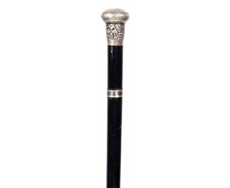 A 19TH CENTURY EBONISED SILVER MOUNTED SWORD STICK with embossed silver work handle and double edge blade 92cm overall. (2)