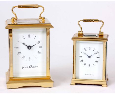TWO EIGHT DAY BRASS CASED CARRIAGE CLOCKS the larger clock signed JENS OLSEN with a spring driven movement with cylinder esca