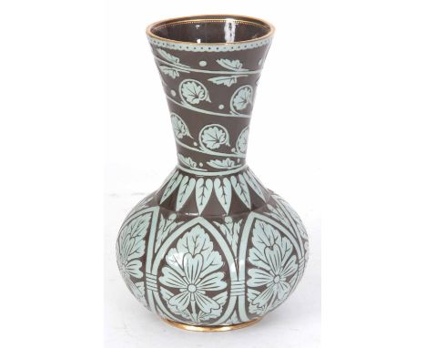 AN ARTS AND CRAFTS STYLE POTTERY VASE WITH BLUE/GREEN SLIP MOULDED DECORATION in the style of Morris & Co 25cm high