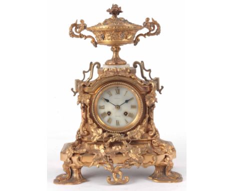 A LATE 19th CENTURY FRENCH ORMOLU MANTLE CLOCK with large urn finial sat on an alabaster plinth above an ormolu case draped w