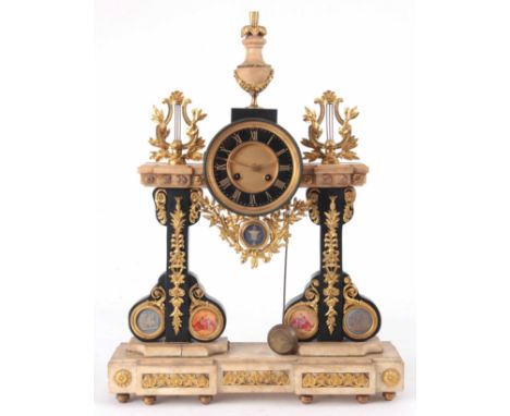 A LATE 19th CENTURY BLACK SLATE WHITE MARBLE AND ORMOLU MOUNTED MANTLE CLOCK with urn finial and ormolu lyre supports, on two