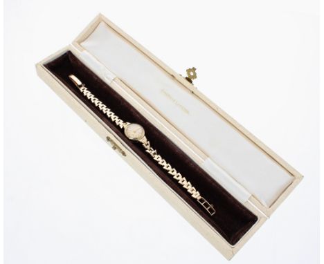 Jaeger LeCoultre 9ct lady's wristwatch, ref. 2605, signed silvered dial with reverse wind crown,16gm, 16mm; with the original