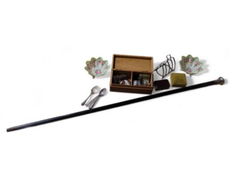 A silver four division toast rack, a silver napkin ring and five silver spoons, 4.6 Troy oz; a silver topped walking cane; th