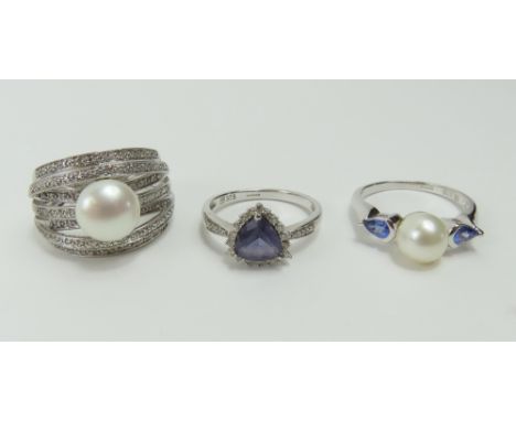A 9ct white gold cultured freshwater pearl and diamond set dress ring, finger size R centre; a 9ct white gold cultured freshw