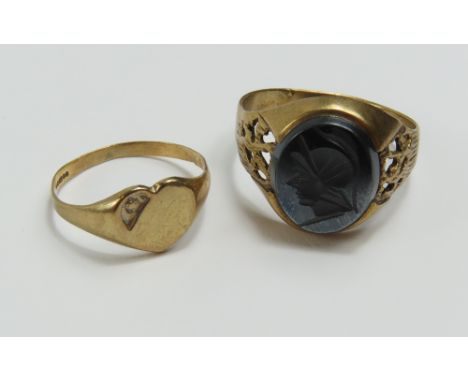 A 9ct gold hematite set signet ring, finger size W and a 9ct gold heart shaped signet ring, finger size N 1/2, 6.15g gross