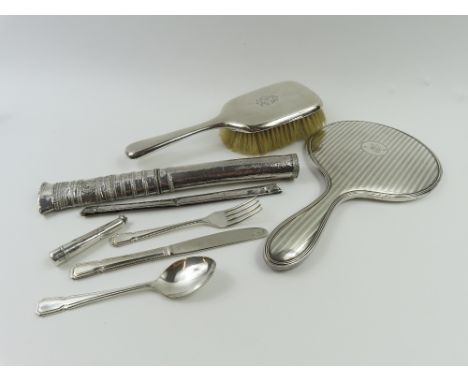 A small collection of silverwares, comprising a silver backed hand brush and mirror, cheroot and cover, scabbard, comb holder