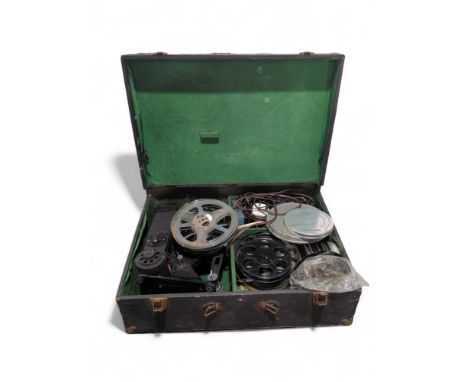 A Pathescope projector with quantity of reels of film in carrying case