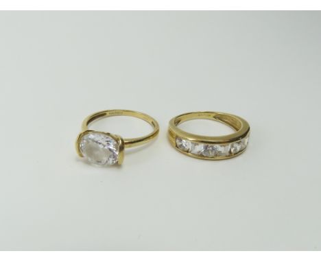 A 14ct gold CZ set half eternity ring, finger size P and a 14ct gold ring set with a large oval CZ, finger size Q, 6.39g gros