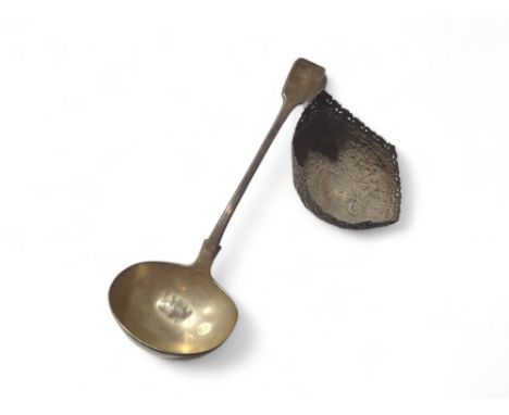 A Victorian silver serving ladle, London, 1839, William Eaton, approximately 7 Troy oz; together with a decorative white meta