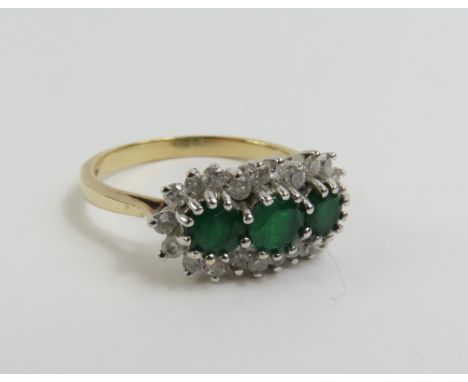 A 9ct gold emerald and diamond triple cluster ring, the three round emeralds surrounded by a row of round diamonds, finger si