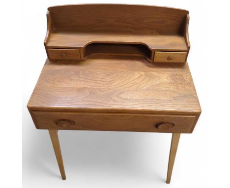 An Ercol dressing table with single drawer long drawer, with raised back with two small drawers and on four legs, 95cm high, 