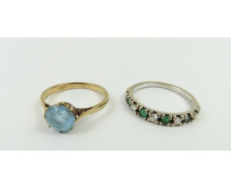 A light blue stone paste ring, finger size L 1/2, tests as approximately 9ct gold, 2g gross