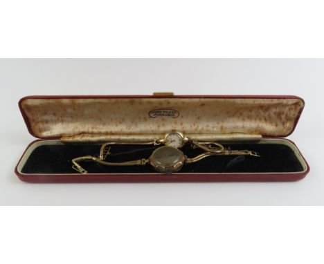 A ladies 9ct gold Tissot wristwatch, on a snake type bracelet, 13.42g gross inclusive of movement and glass; and a 9ct gold c