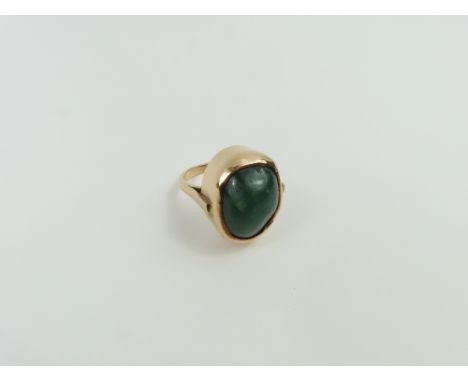 A dark green hard stone set ring, in a mount marked '9ct', finger size O, 12.95g gross