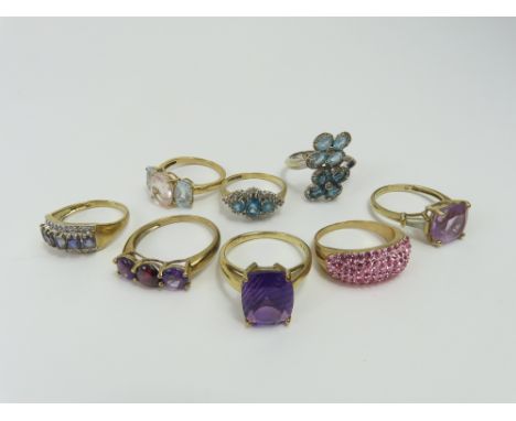 A 9ct gold amethyst single stone ring, finger size Q, a 9ct gold three stone ring, finger size T, a 9ct gold blue and white s