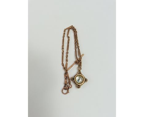 A mixed link rose gold converted watch chain, the swivel clasp marked '9 375', and the T bar hallmarked, with a miniature com