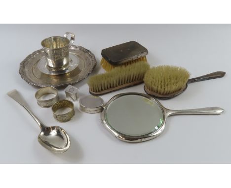 A collection of mixed silverwares, mixed dates and makers, comprising three silver-backed brushes, silver hand mirror, christ