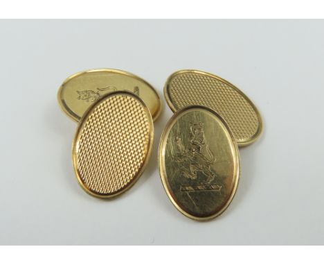 A pair of 9ct gold cufflinks, the oval panels with engine turning to one side and the lion rampant on the other, 7.62g gross