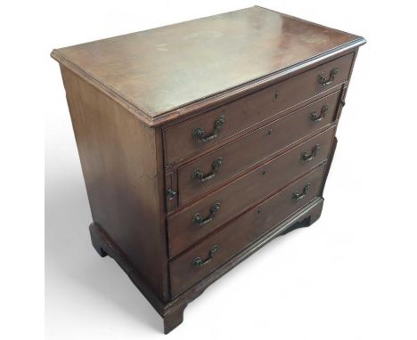 A 20th century mahogany chest of four long drawers of increasing size descending, with scaled swing brass handles and upon br