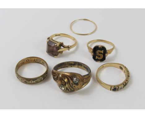 A 9ct gold smoky quartz cocktail ring, finger size K 1/2, a 9ct gold synthetic stone full eternity ring, finger size N 1/2, a