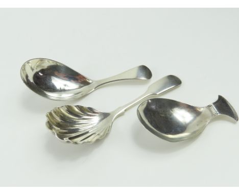 A George III silver caddy spoon, and two others, 41g gross